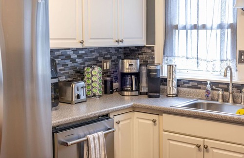 Portland House | Classic Maine home in quiet tree-lined street neighborhood with fenced in yard