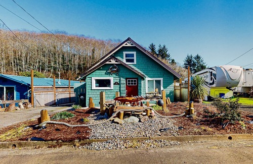 Winchester Bay House | Coastal home with an enclosed yard, hot tub, grill, fireplace, and W/D - dogs ok