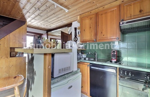 Lauenen Bei Gstaad Ski Chalet | Comfortable chalet on 3 levels for 5 people in Mayoux, living room with wood-burner, kitchen area wi