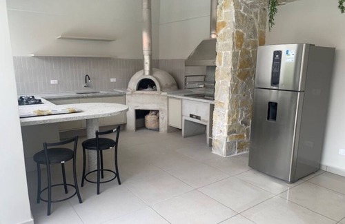 Jardim Virginia House | Comfortable house with 4 suites in a luxury condominium in Guaruja
