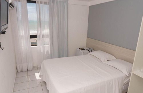 Areia Preta Apartment | Confortável suíte integrada com vista mar em Natal por Carpediem