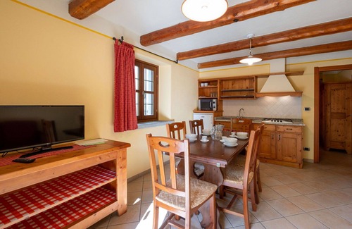Sampeyre Apartment | Cosy apartment for 4 people with pool, WIFI, TV, terrace and parking
