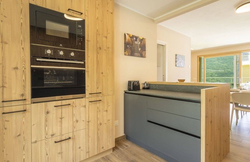 Bianzone House | Cosy apartment in villa for 8 people with WIFI, A/C, TV, terrace, pets allowed and parking