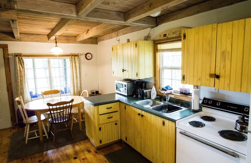 Arrowsic Cottage | Cottage featuring a Screened Porch overlooking the Water