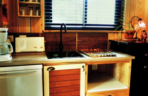 Saint-Andre-de-Cruzieres Ski Chalet | Cozy cottage under the oaks with outdoor kitchen, ideal for recharge.