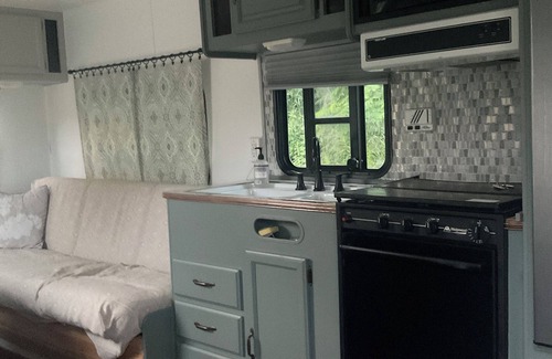 Kewadin RV Rental | Cozy campground with 1 bedroom and WiFi, AC near beautiful Elk Rapids
