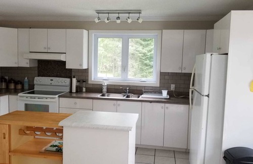 Cayamant Ski Chalet | Cozy cottage on a beautiful shallow sand beach at Patterson lake!