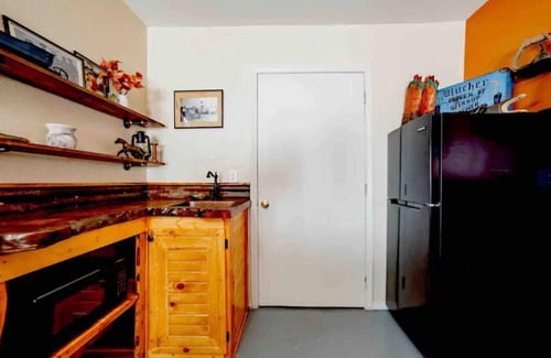 Beggs Apartment | Cozy efficiency on Main St. in Beggs America, highlighting The Blucher Boot Co.