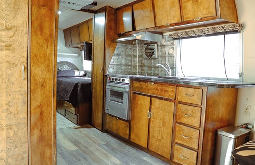 Poteau House | Cozy Vintage Airstream among the pines on World's Highest Hill. Pet-Friendly!