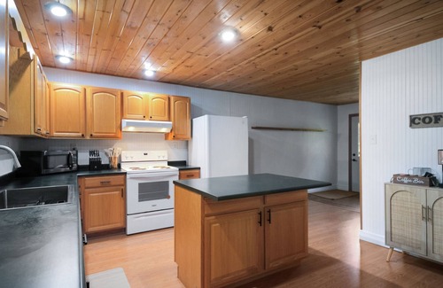 Paris House | Crystal Rapids Retreat: Cozy Up to Autumn's Beauty on the Muskegon River.