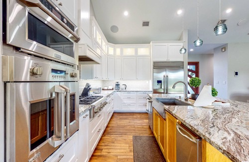 Waller House | Custom home with guesthouse, pond, sunning deck, beach & tropical bar