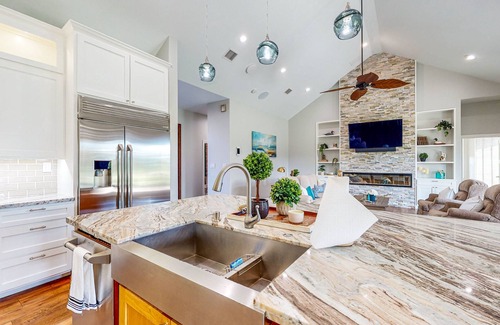 Waller House | Custom home with guesthouse, pond, sunning deck, beach & tropical bar