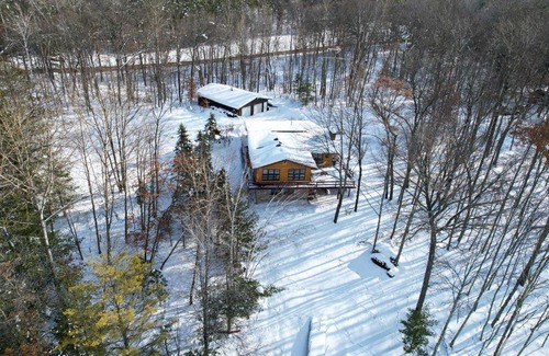 Danbury House | Danbury Cabin with Wraparound Porch on Lang Lake!
