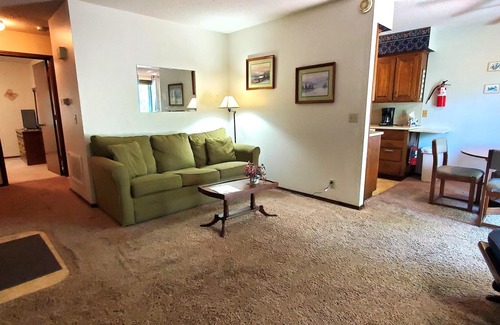Holiday Island Condo | DECK OVERLOOKS THE PEACEFUL SERENITY OF THE LAKE