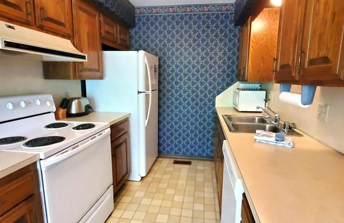 Holiday Island Condo | DECK OVERLOOKS THE PEACEFUL SERENITY OF THE LAKE