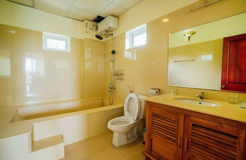 Cua Lap House | Delux family room with pool view- Be Home 4 Sunset House