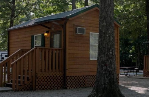 Manchester Cabin | Deluxe Cabin (w/Bathroom) - Deluxe Cabin (w/Bathroom) Better than a motel! Enjoy camping in comfort! Kitchen with stove top and full size fridge with dishes pots included. Full bathroom with shower. Cable TV DVD player. Gas grill on your own concre