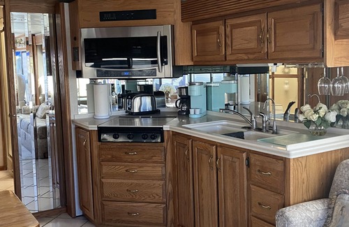 St. George House | Desert Hideaway RV Inn *Pets Welcome{no fee}* Stone pool w/relaxing Waterfall
