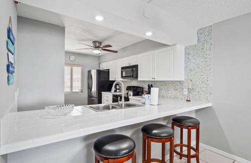 Cocoa Beach Condo | Direct Ocean Front Condo Steps to the Beach with Heated pool, Hot tub and Tennis Court!