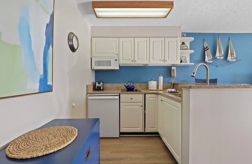 Charlevoix Condo | Edgewater Inn Condo #117D with Waterfront Access | Pool, Hot Tub, Sauna