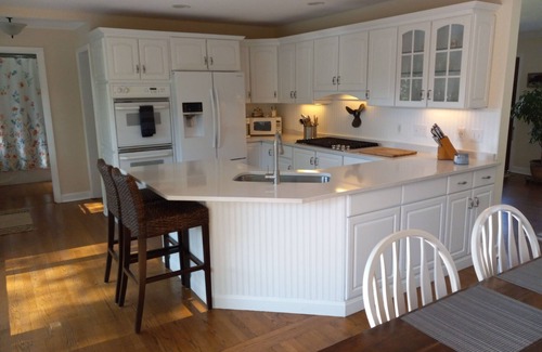 Powers Lake House | Enjoy this updated home just steps from the sandy beach in Powers Lake.