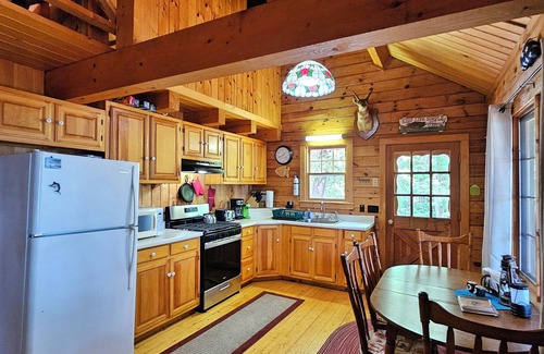 Willimantic Cabin | Escape to Howie's Camp: Unwind and Recharge at This Lakefront Log Cabin