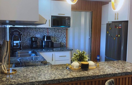 Prado Oriental Apartment | Exclusive Luxury & Comfort Condo Near Airport, Beach, and Attractions