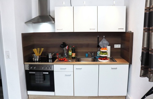 Traunreut Apartment | Ferienwohnung 55qm mit Balkon und Gartenblick