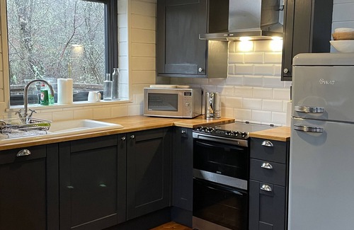 Dallavich Cabin | Flora is a Well equipped, Scandinavian style log cabin with wood fired hot tub