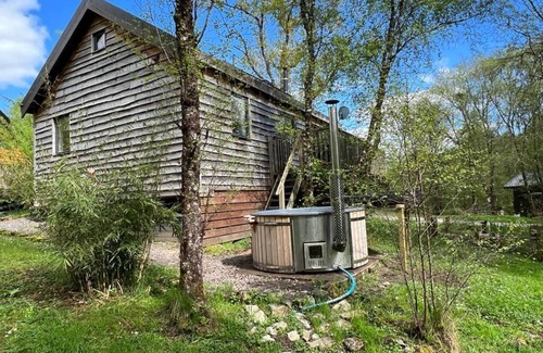 Dallavich Cabin | Flora is a Well equipped, Scandinavian style log cabin with wood fired hot tub