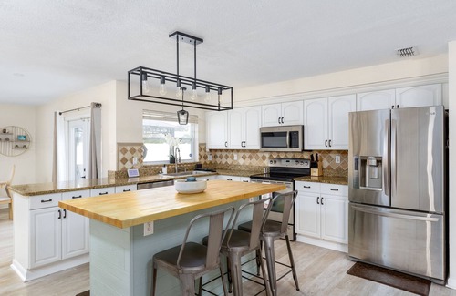 Pinellas Park House | FREE Heated Pool Home near the beaches Slps 12 Water Slide Fire Pit