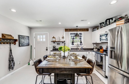 Wichita House | Front door parking, private covered patio with fenced in backyard