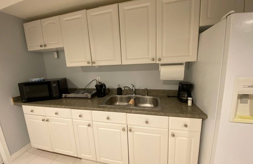Lisgar Apartment | furnished basement studio, with1 queen bed, a kitchenette, and 1 bathroom. n