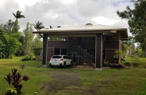 Hawaiian Acres Cottage | "Glamping" at its finest with wrap around lanai and jetted tub