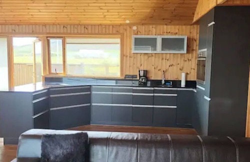 Arnarstapi House | Glass House with Private River & 360° Views