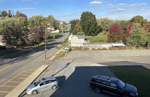 Sugarcreek Apartment | Great bedroom with private bathroom & Lounge above a local Diner