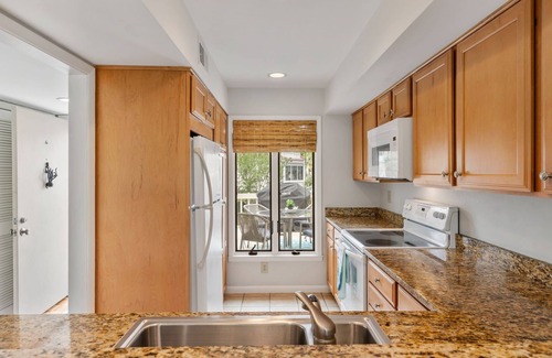 Spinnaker Beachhouses House | Great Location! Walk to Beach, Club, Golf, Pools! Distant Ocean Views! Amenity Cards!