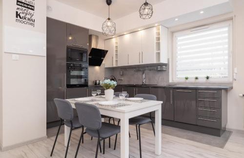 Sosnowiec Apartment | Ground Floor Apartment with Garden and FREE GARAGE in Sosnowiec by Noclegi Renters