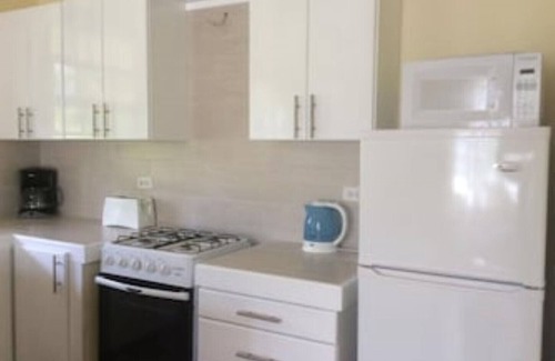 Sunset Crest Apartment | Ground Floor Apt with garden only 3 mins walk to Beach and Beach Club