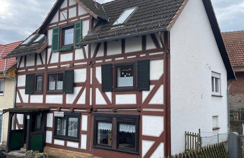 Alheim Apartment | Guest room with private bathroom, in a vacation home, centrally located