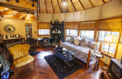 Rough and Ready Apartment | Handcrafted Roundhouse studio & loft. Large sky window + private outdoor shower