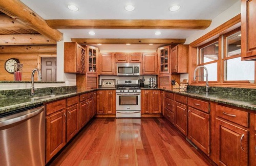 Alanson House | High In The Tress Overlooking Multiple Lakes