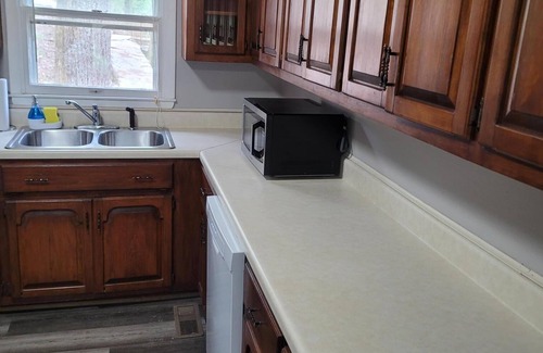 Cullman Cabin | Historic Cabin in a natural setting with waterfalls and covered bridge