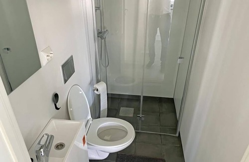 Vestbygd House | Holiday home 'Lista Maritim 1', built 2020, directly by the sea in Borhaug-Borshavn near Farsund on the Listafjorden, southern Norway, 6+3 persons, panoramic windows and terrace with spectacular sea views, modern furnishings, open plan living, 5 b.