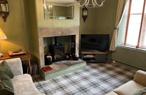 Idle House | Honeybee Cottage, with a log fire & a hot tub.