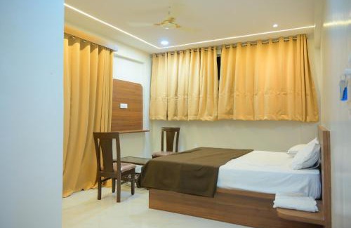 Madha Hotel | Hotel Amruta, Themburni, Madha