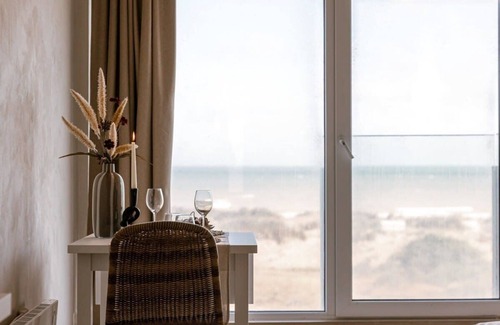 Oostduinkerke-Bad Apartment | Huswell - Modern studio with magnificent seaview