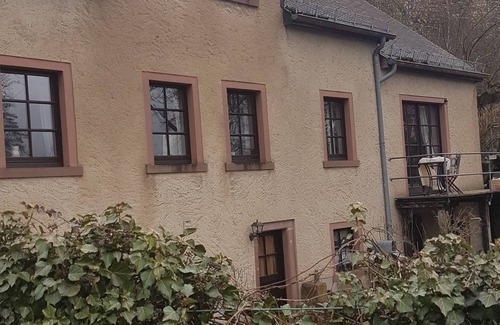 Hillesheim Apartment | Idyllic mill building directly on the city wall with a large garden