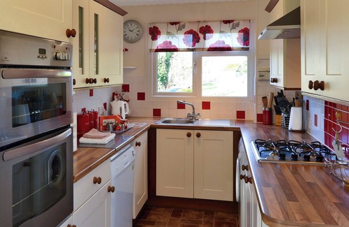 Wroxham Cottage | Imagine relaxing on the patio, watching the boats and river life pass by.