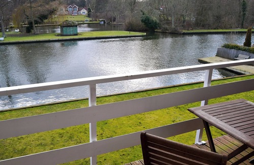 Wroxham Cottage | Imagine relaxing on the patio, watching the boats and river life pass by.